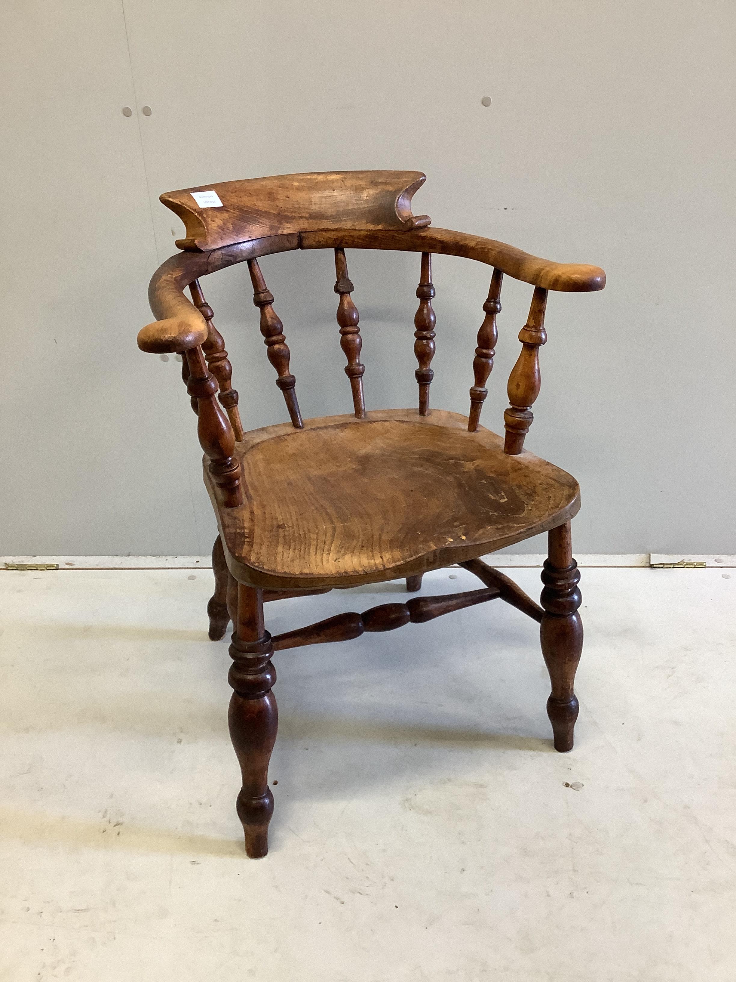 A Victorian elm and beech Windsor smoker's bow elbow chair, width 59cm, depth 47cm, height 80cm